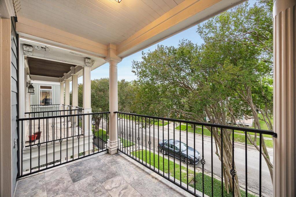 Covered balcony overlooking the front yard.