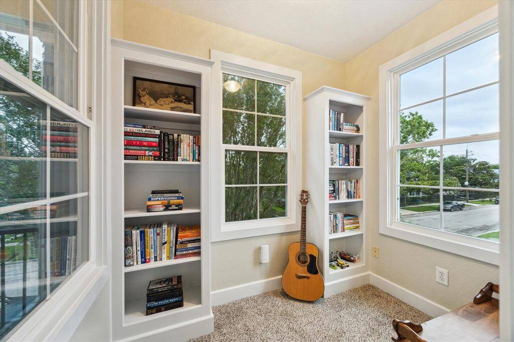 An amazing reading nook with built-ins, bathed in natural light.