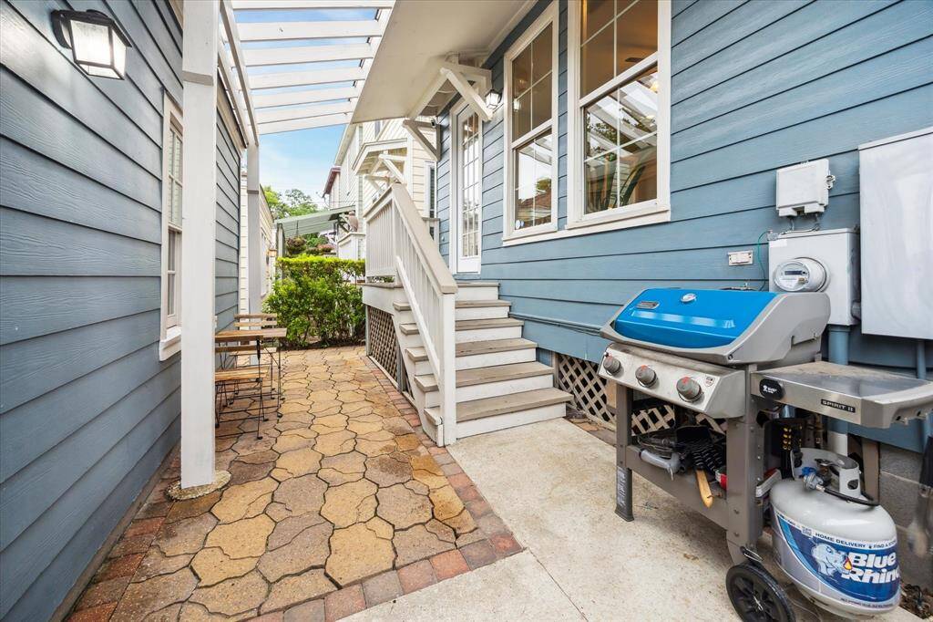The paved courtyard is the perfect spot to grill and enjoy the outdoors.