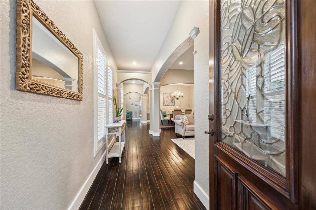 Welcome your guests with beautiful hardwood floors and graceful archways that lead seamlessly into each living space.