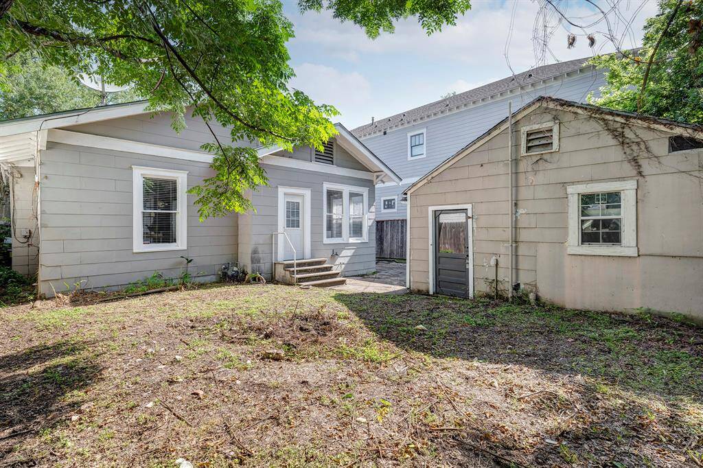 Backyard with detached two car garage.