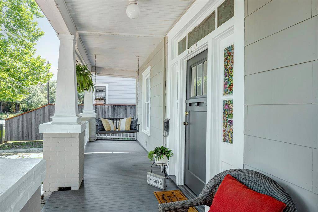 Expansive quintessential Heights front porch.