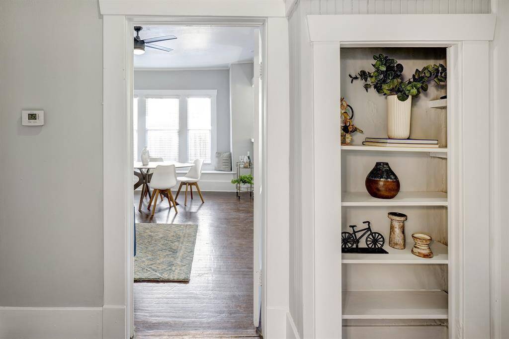 Hallway area from the bathroom with bedrooms flanking both sides.