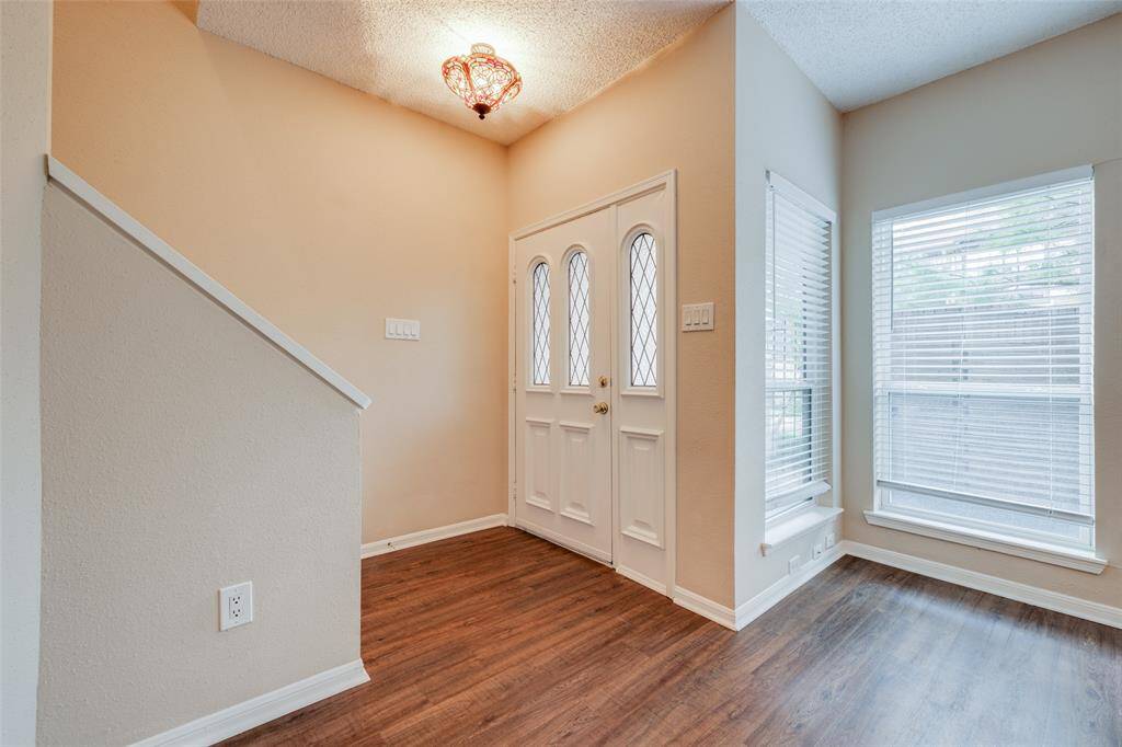 Laminate flooring is featured throughout, providing a clean, smooth, and durable surface that is easy to maintain and clean. It is perfect for furniture, pets, and handling foot traffic.