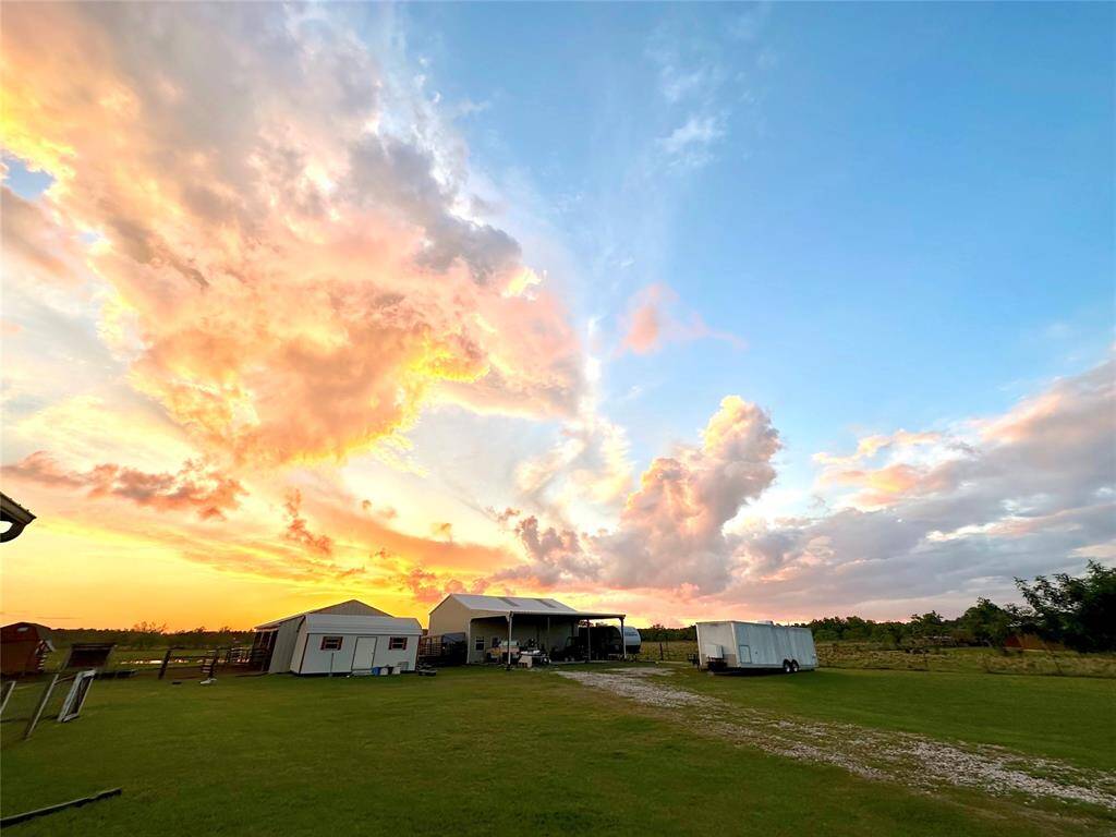 Spacious 20 acre property, set against a stunning sunset sky. Ideal for those seeking tranquility and outdoor space.
