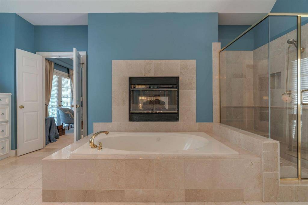 Fireplace, large soaking tub and separate shower.