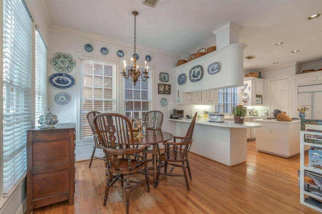 Charming breakfast room off kitchen.  Door on the left leads to outside area.