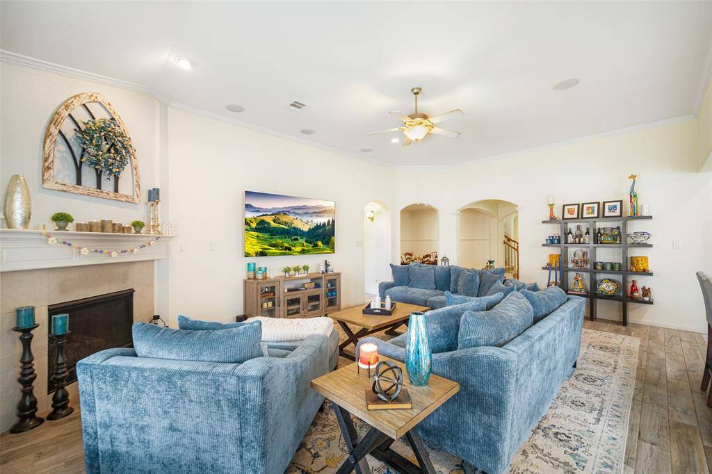 This inviting family room offers the perfect blend of comfort and style. A stunning fireplace serves as the focal point!