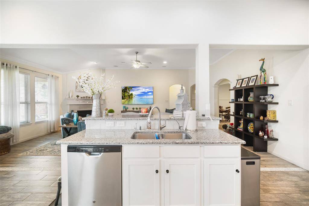 Your sink overlooks the family room so you can stay in touch with your guest! Notice the high bar top for bar chairs and quick meals!