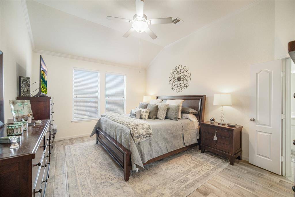 This beautifully appointed primary suite features warm natural tones and abundant natural light!