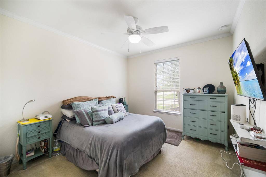 First of 2 secondary bedrooms with a ceiling fan and generous closet space!