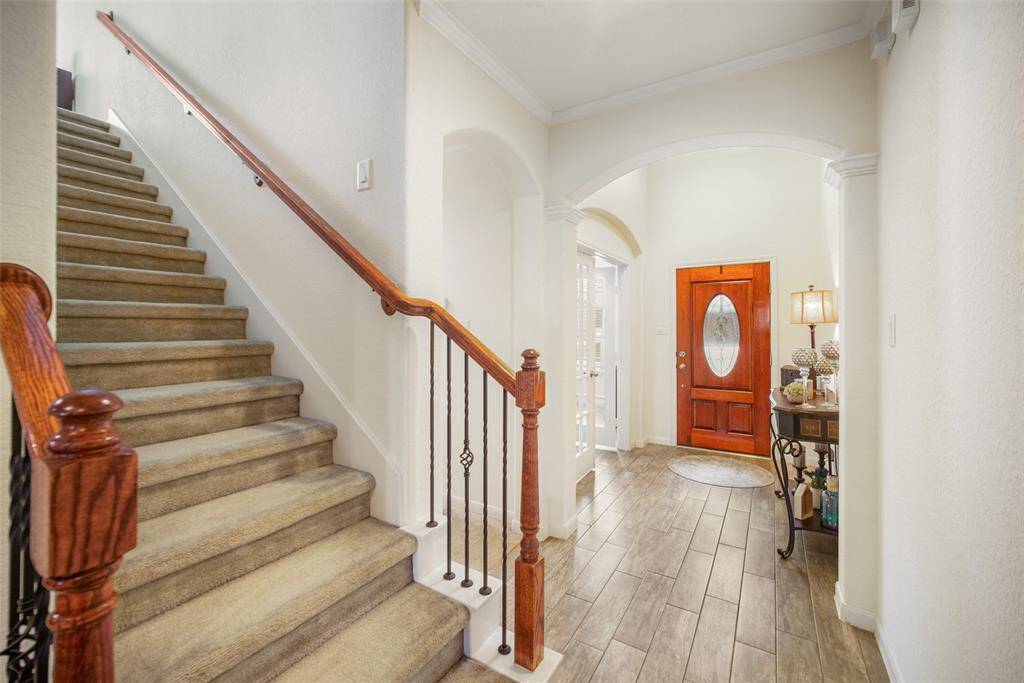 A view looking from the stairs to the front door! Spacious entry way and foyer!