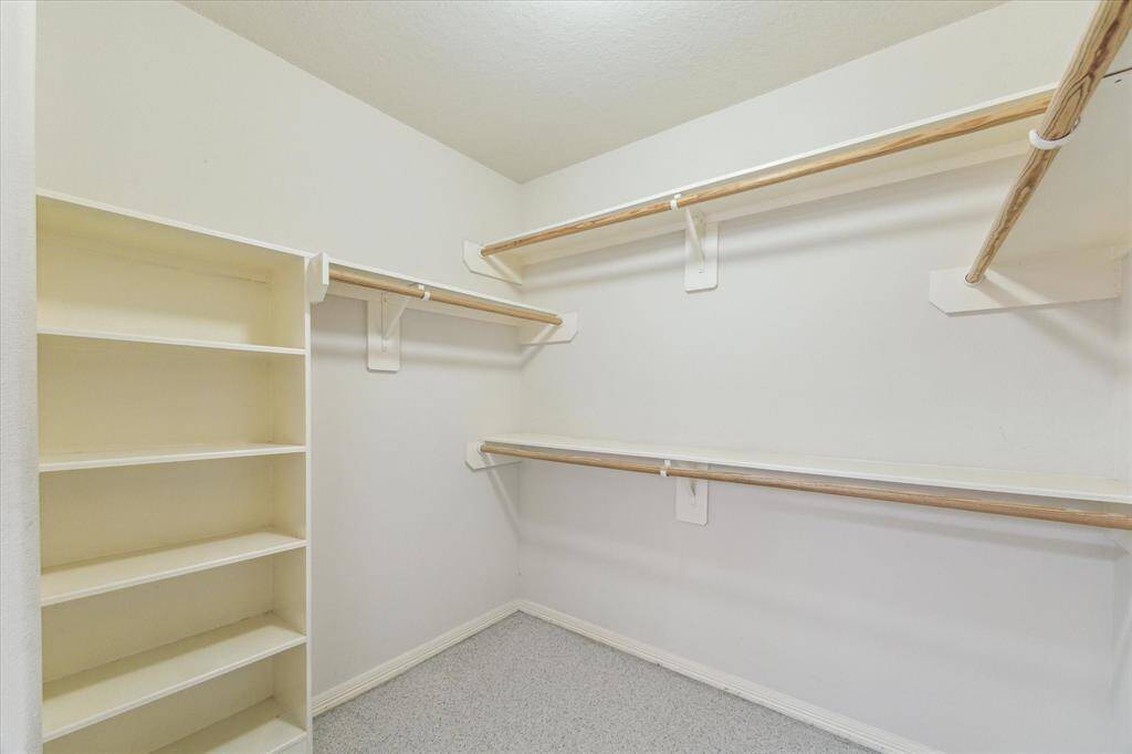 The primary walk-in closet gives you everything you need and more to store your wardrobe and build upon it, if need be.