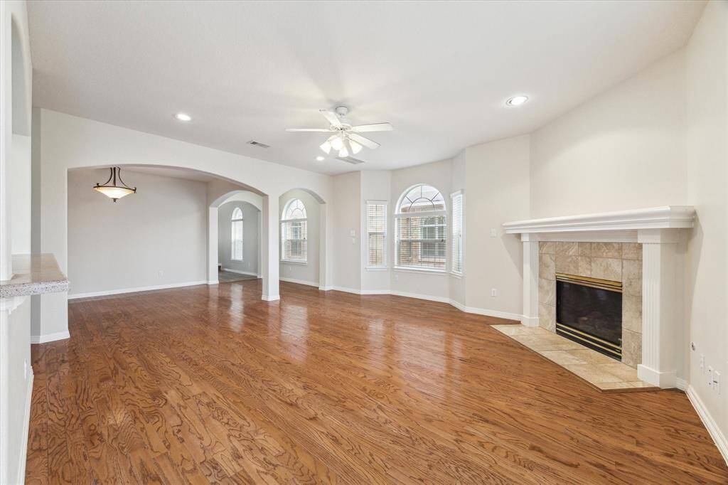 The gas log fireplace adds a touch of cozy to the living space.