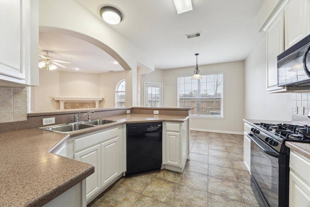 The kitchen cabinets were recently painted to brighten up the space even more.