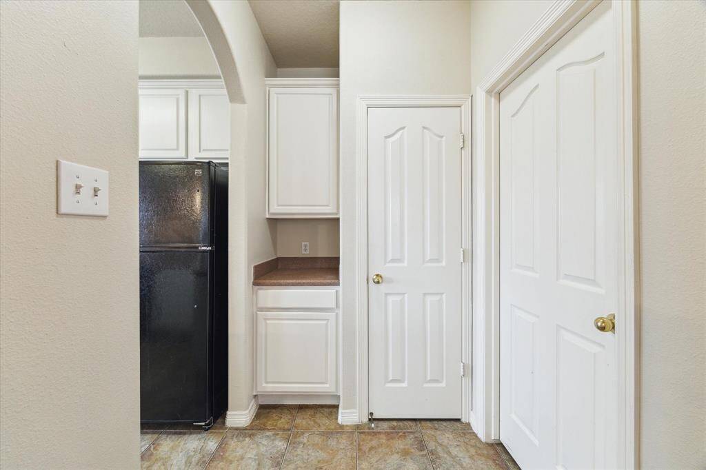 Additional cabinets/mini butlers pantry located off the kitchen.