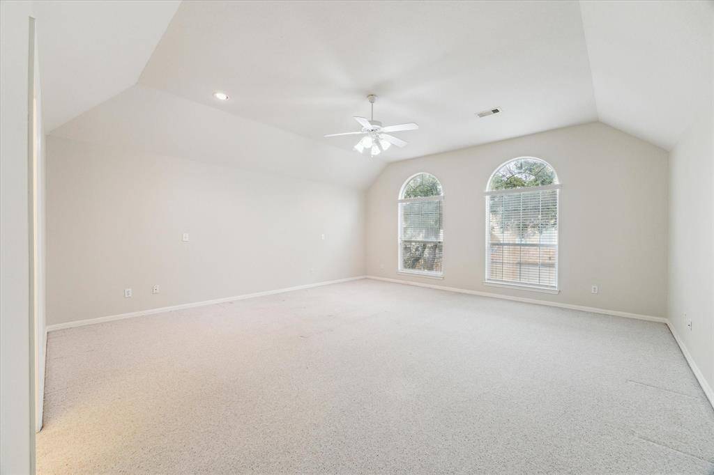 Now this is a primary bedroom! There's more than enough space for a kind bed, 2 nightstands, accent chairs and dresser.