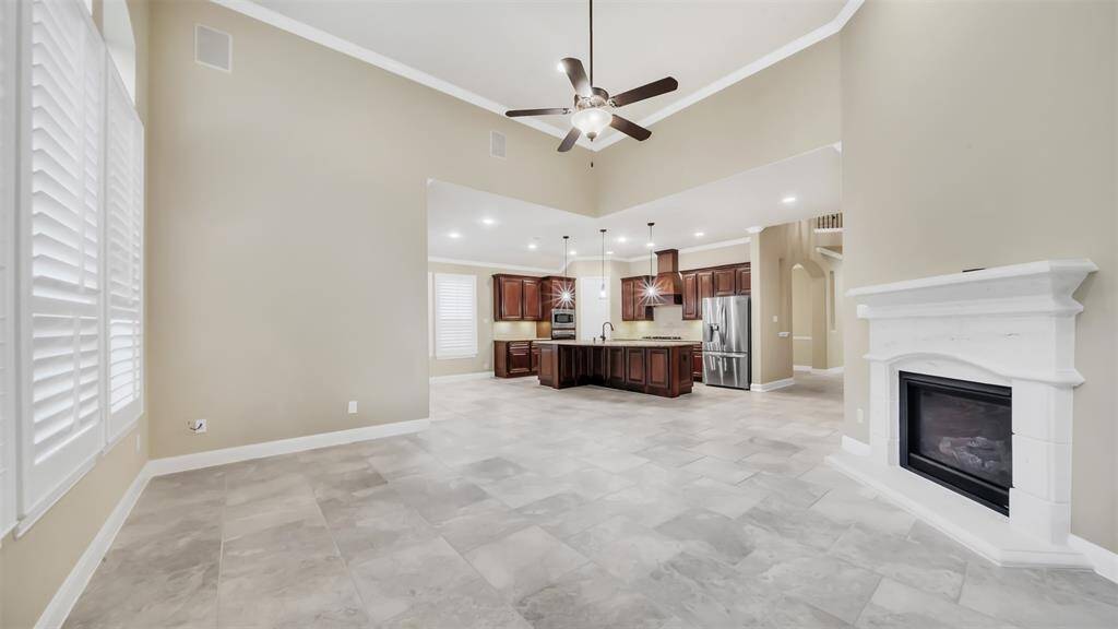 The open layout seamlessly flows into the breakfast area and kitchen, making it ideal for both everyday living and hosting guests. With its inviting design and thoughtful flow, this living space offers comfort and style for any occasion.