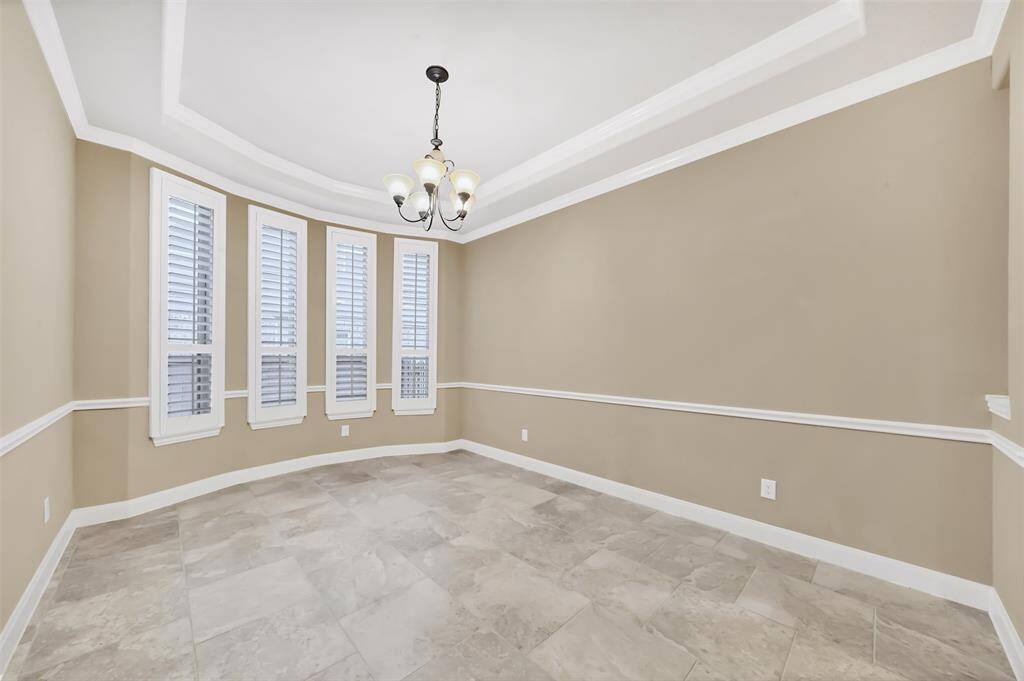 Formal Dining Room with tile flooring and Plantation Shutters