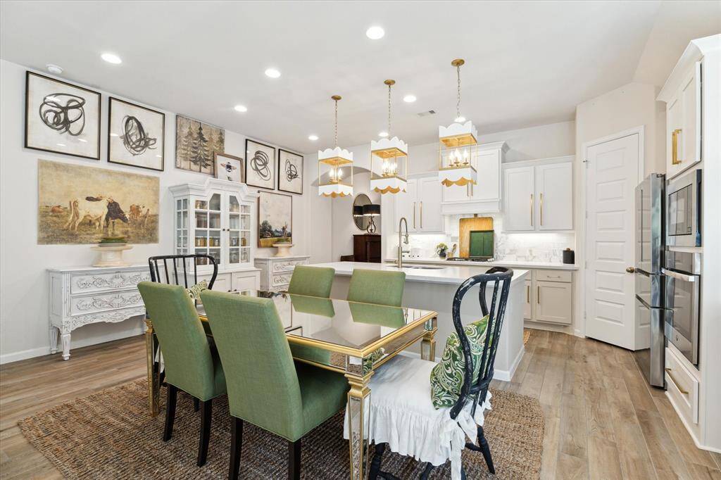 The dining area can accommodate a large table and the island provides opportunity for extra seating.