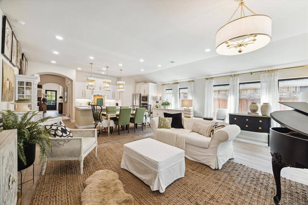 Overview of the open concept space. This open area makes it easy to gather and entertain and allows for an easy transition to the outdoors from the living room.