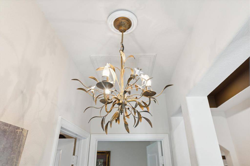 This chandelier adds a whimsical touch to the guest bedroom hallway. It stays with the house!