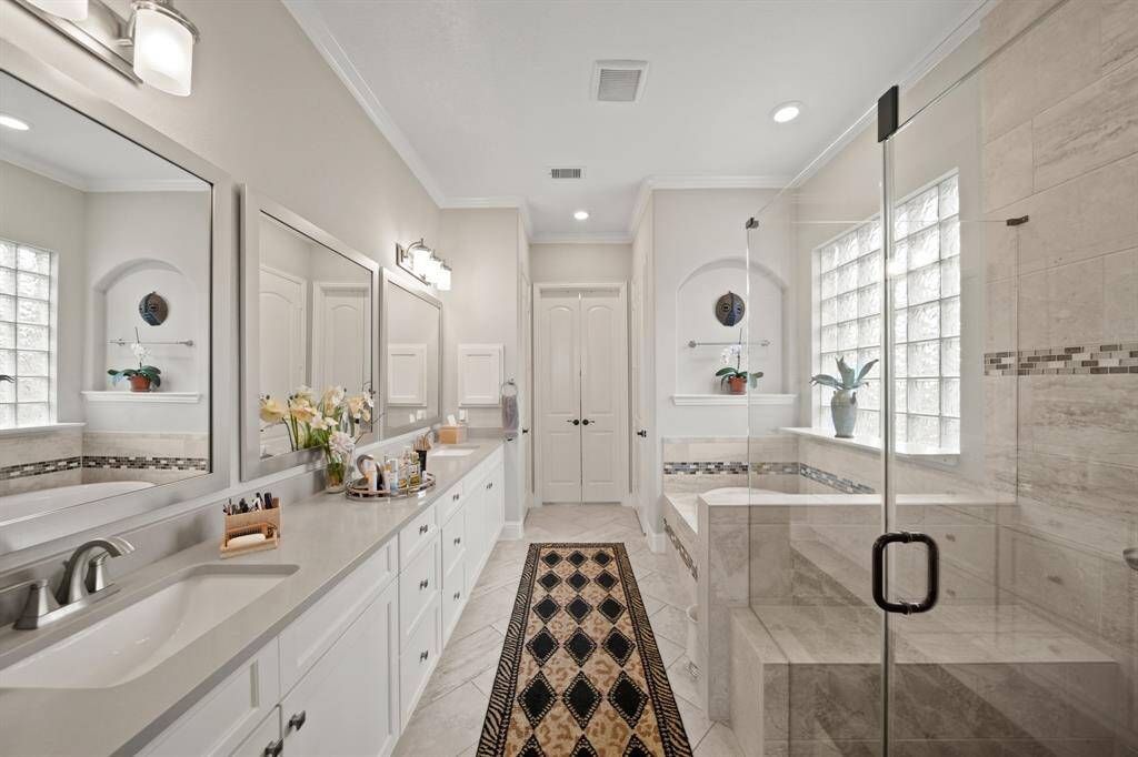 This luxurious ensuite is certain to offer a relaxing escape from the long day.