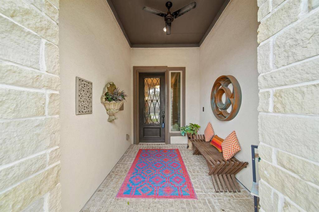Welcoming patio leading to the entry of this home.