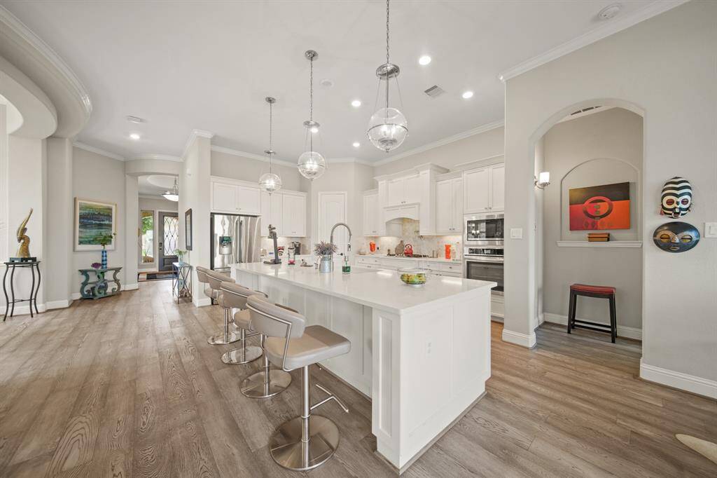 4 Bar stools easily fit along this expanded kitchen island.