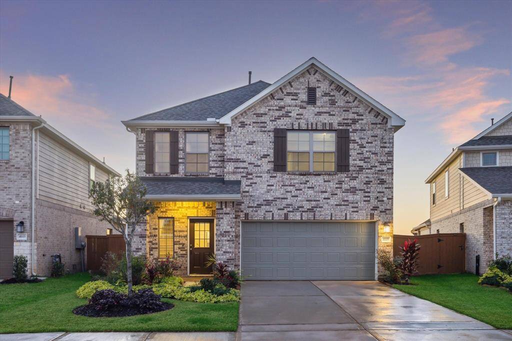 Discover the charm of this beautifully landscaped traditional home in the master-planned Marvida community. Featuring a fresh exterior with updated paint on shutters and doors, and Rockport brick accents, this home welcomes you with curb appeal and meticulous attention to detail. The HOA-approved stained fence and lush plantings, including double knock-out roses, complete the picturesque setting.