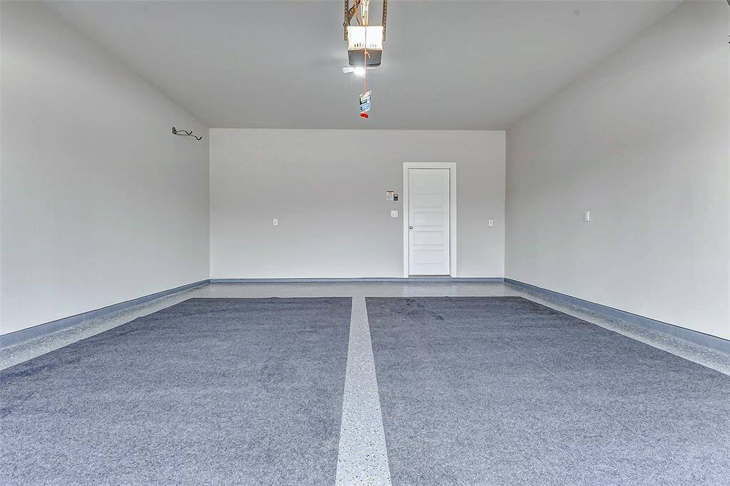 This pristine two car garage features a sleek epoxy coated floor, upgraded wall hooks, and a private entry to the interior. It’s more than a place for your car it’s bonus space for storage or hobbies.