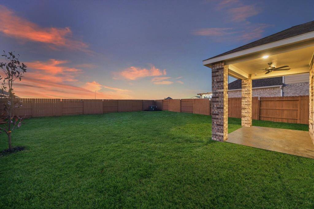 This expansive backyard is a blank canvas for your outdoor dreams. From gardening to gatherings, its size and beauty create endless possibilities.