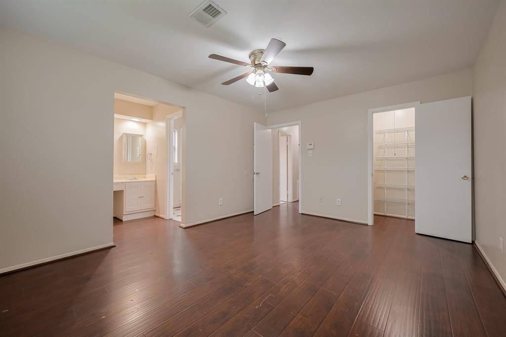 Spacious primary bedroom that offers two closets.