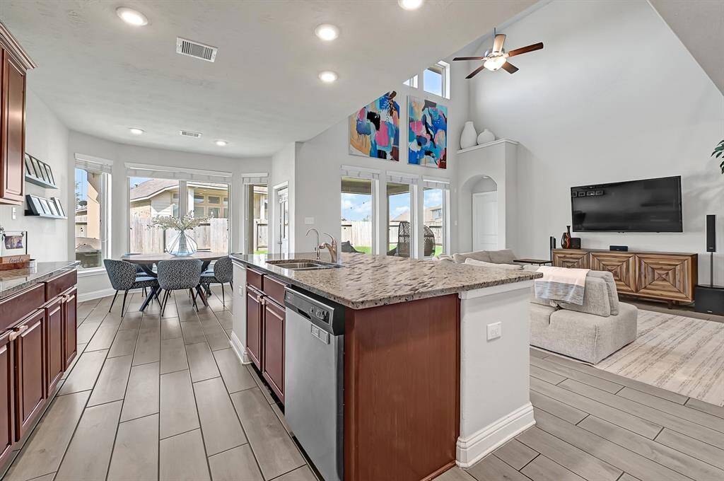 The granite island is the perfect place to grab a quick bite, finish some homework, or hangout with your favorite people. Plus, now you're able to watch your favorite sports team or show while finishing up some daily chores.