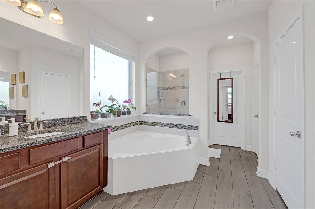 Your first floor primary suite includes a private ensuite bathroom, offering convenience and tranquility.