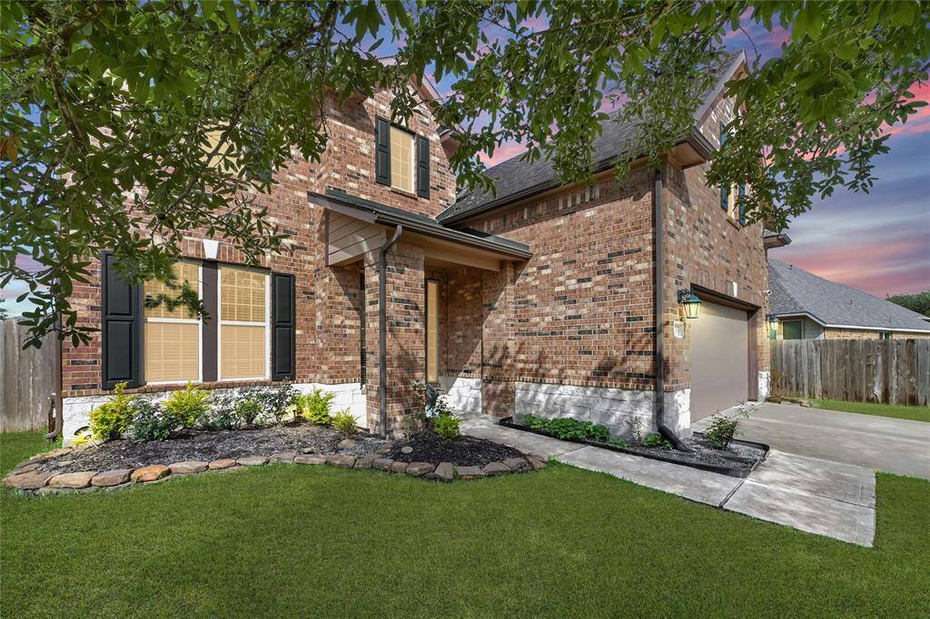 Your new home is sure to please with stunning curb appeal including a young shade tree to grow with your family, lush landscaping, gleaming double-pane windows, and brick & stone exterior.