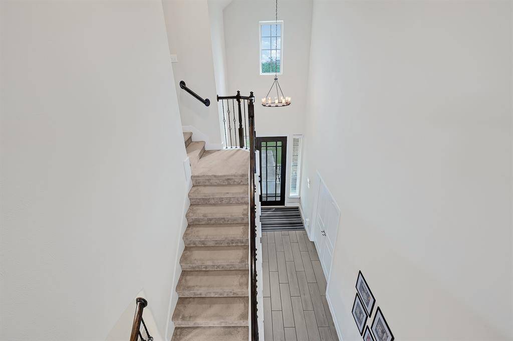 The second floor game room comes complete with built-in floating shelves and cabinetry.