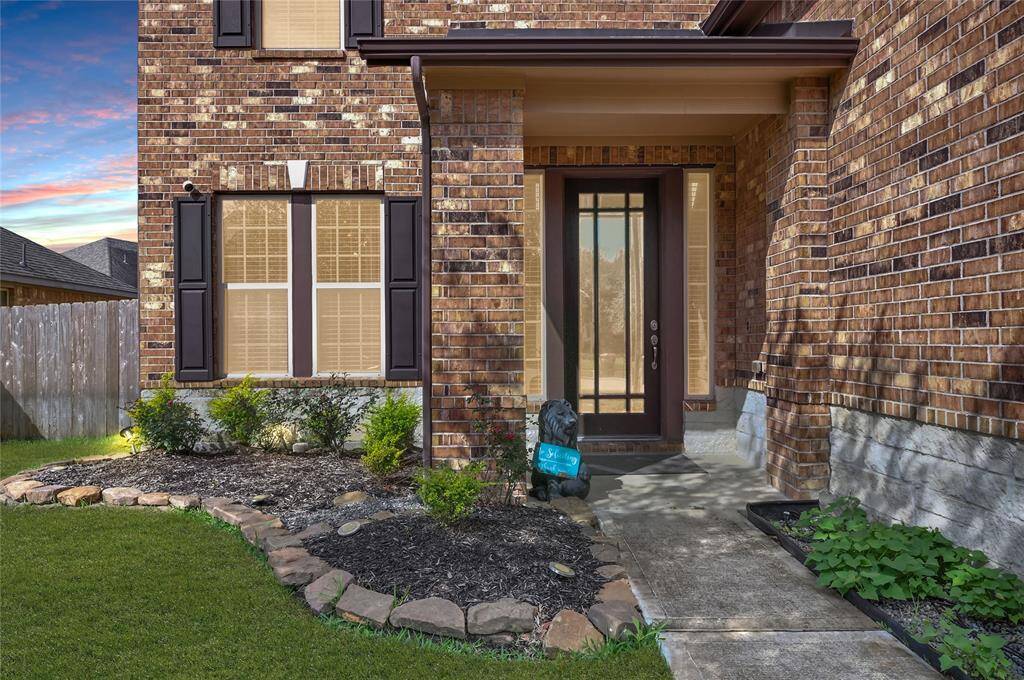 The eight foot lead glass front door paired with two sidelight windows illuminate the foyer to welcome you home!