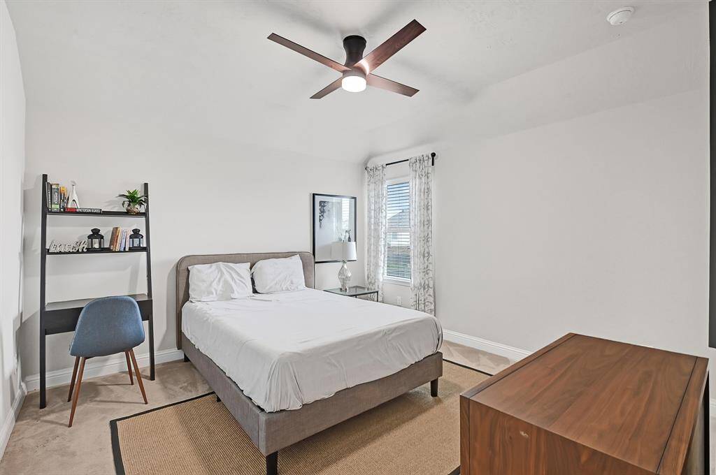 View of the expansive living area from the second floor catwalk balcony.