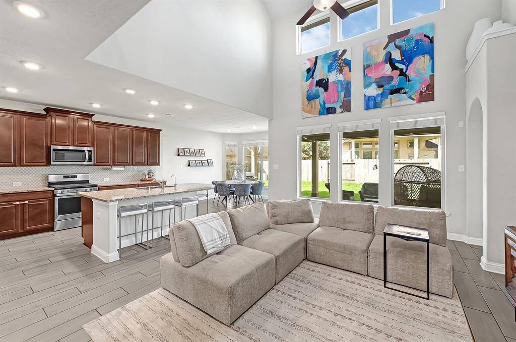 There's plenty of room for all of your friends and family to gather in your spacious new living area. Plentiful natural lighting pours in through large double-pane windows, 2-story ceiling, and open concept living are only a few features of your exquisite new home.