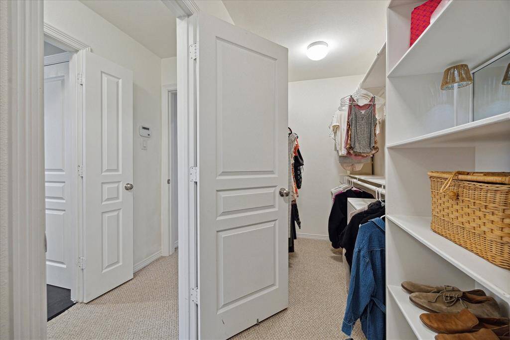 One of two primary closets.  The door to the left of the picture is the primary bath entrance.