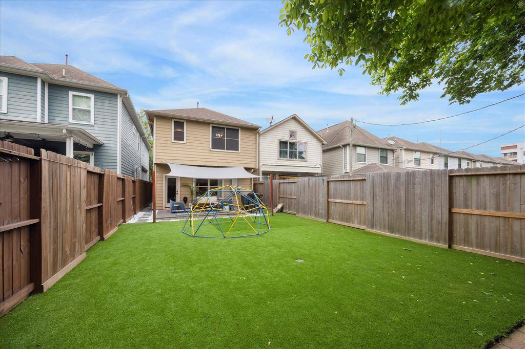 Wow!  This yard will not disappoint!  Fully fenced, turf, shade structure and ready for action.