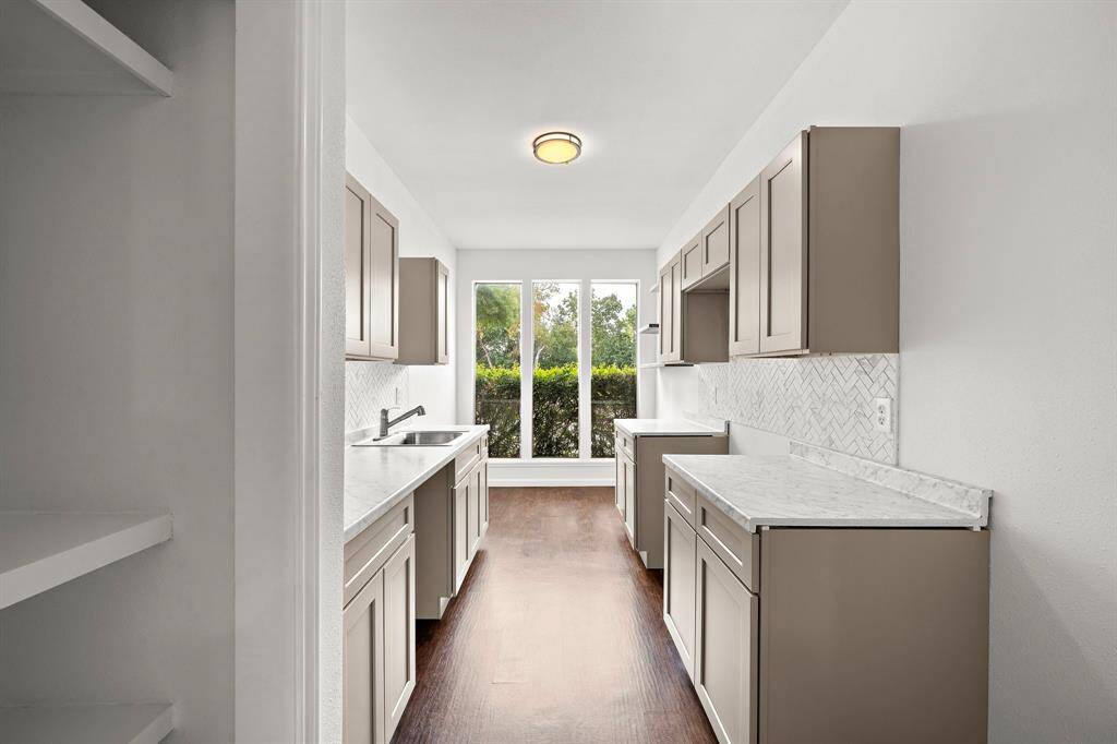 Recently updated kitchen featuring big windows for ample natural lighting.