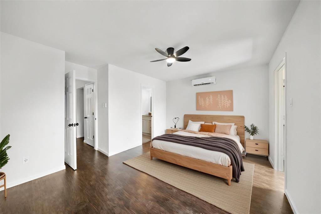 Upstairs primary bedroom virtually staged.