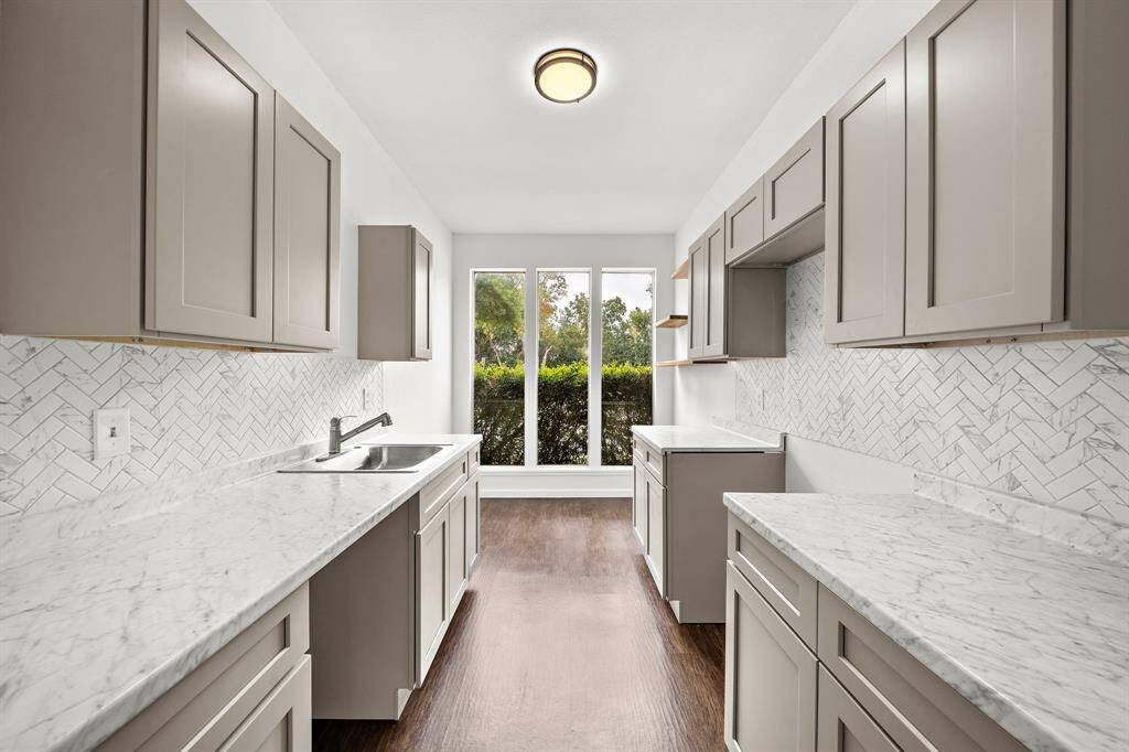 Recently updated kitchen featuring big windows for ample natural lighting.