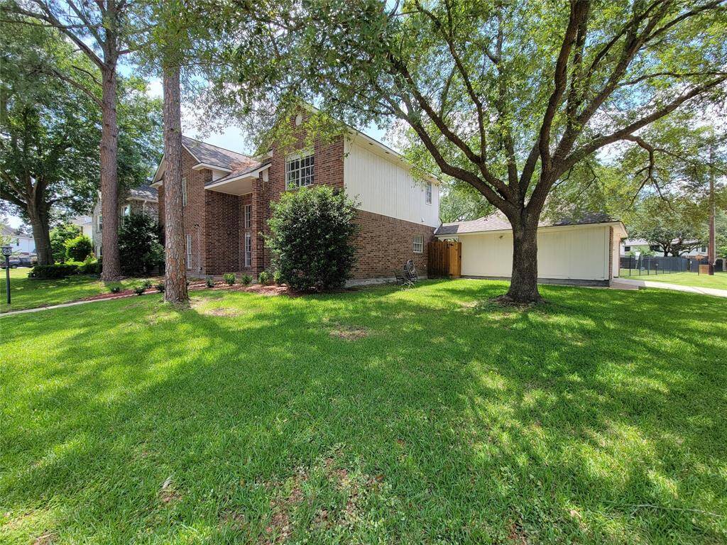 Charming two-story brick home nestled under mature trees. Spacious yard perfect for outdoor activities and relaxation. Ideal for those seeking a serene suburban lifestyle.