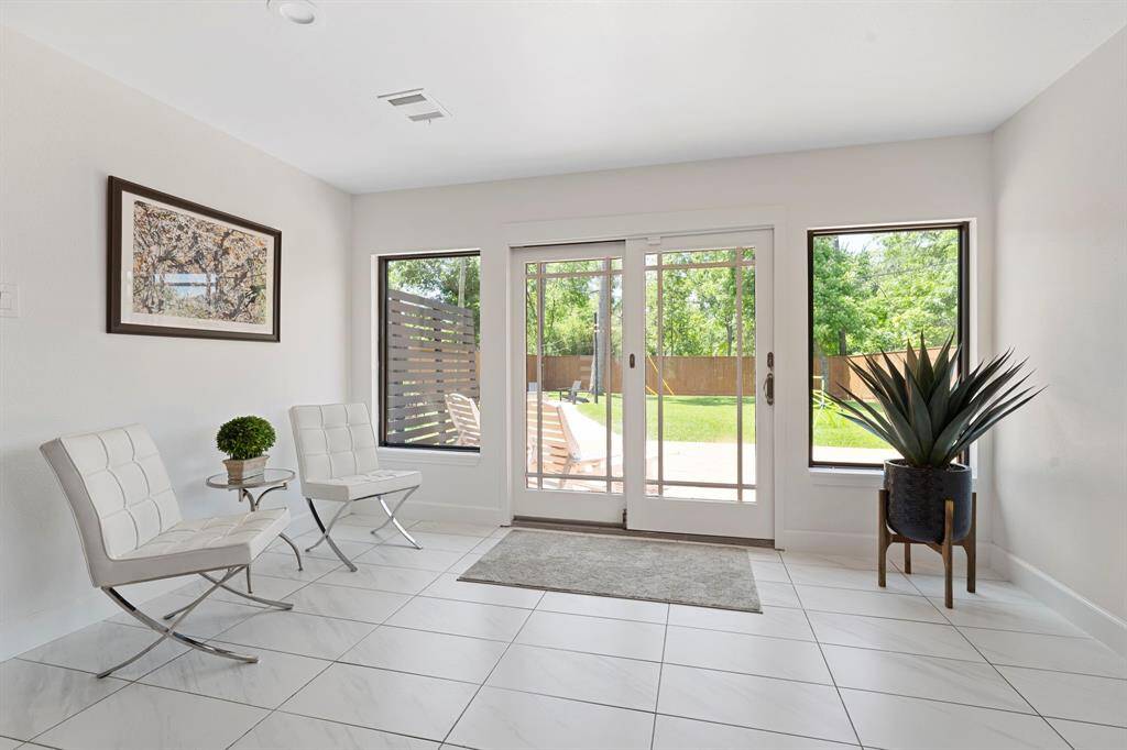 The sunroom area can be used for home office, pet or play area.  Fabulous views bringing the outdoor in.