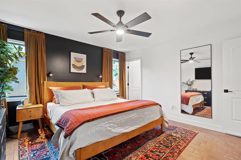 Primary bedroom suite with wood floors, private bath - all fully renovated.  Each closet has Elfa Door Organizing systems.