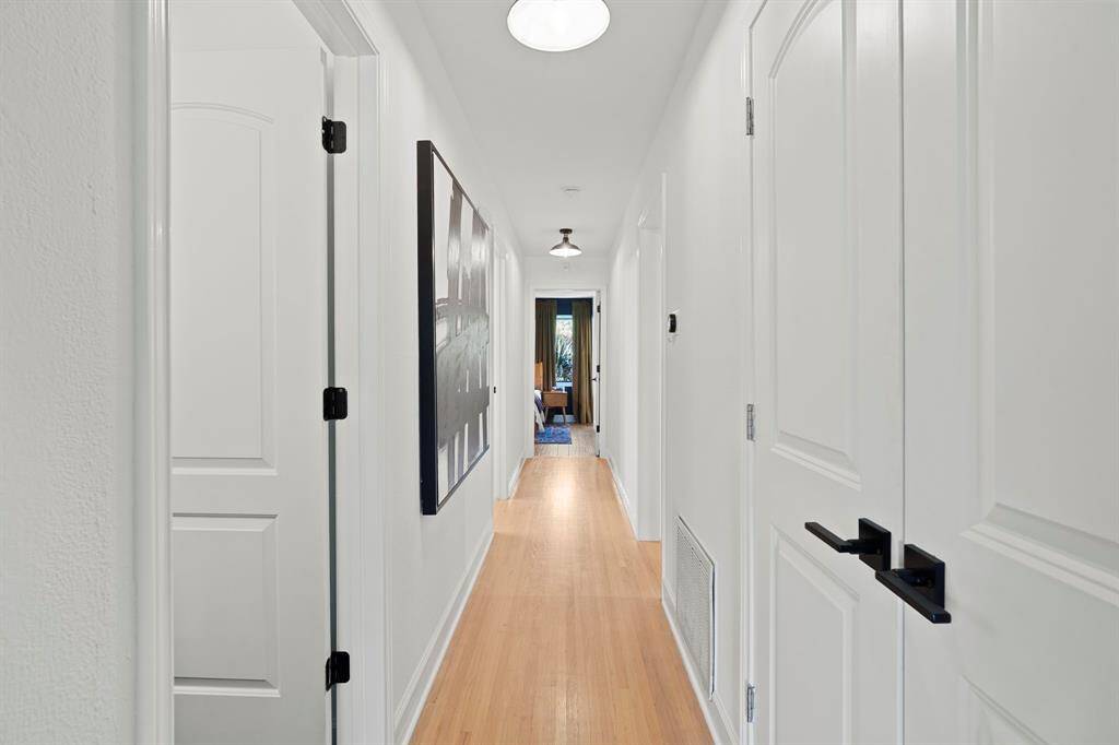 The bedroom hallway looks like an art gallery!  All new interior doors and hardware.