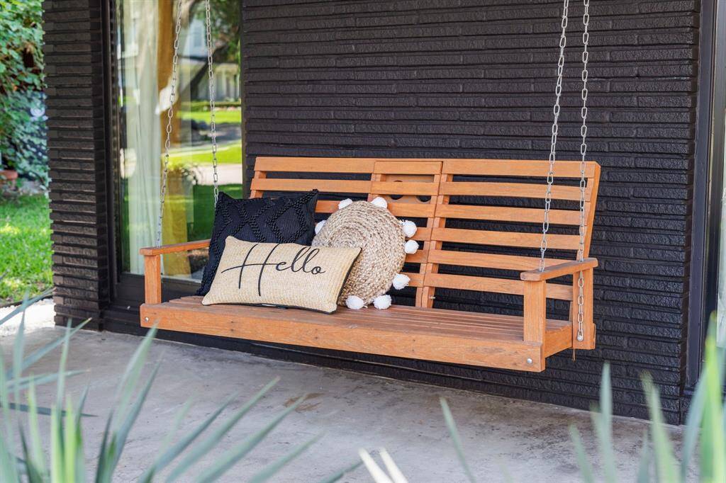 While away on the front porch swing. The property is perfectly positioned for no cut-through traffic, making it nice and serene.